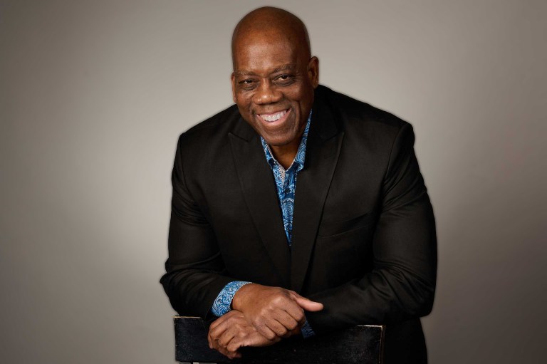 eric leaning on back of chair 768x511